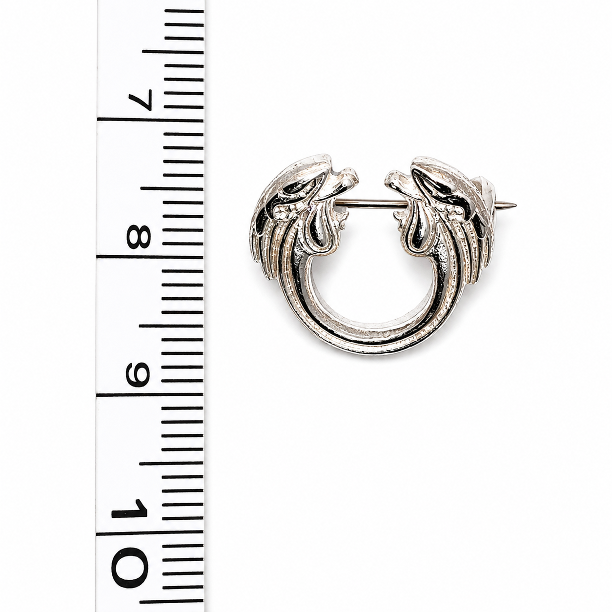 Jesus Christ Superstar silver plated lapel pin brooch shown with ruler for size reference.