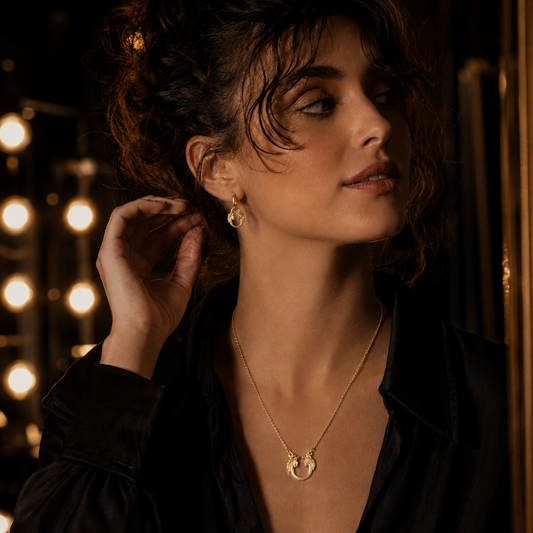 Jesus Christ Superstar sterling silver necklace styled in a dramatic lifestyle image for musical theatre fans.