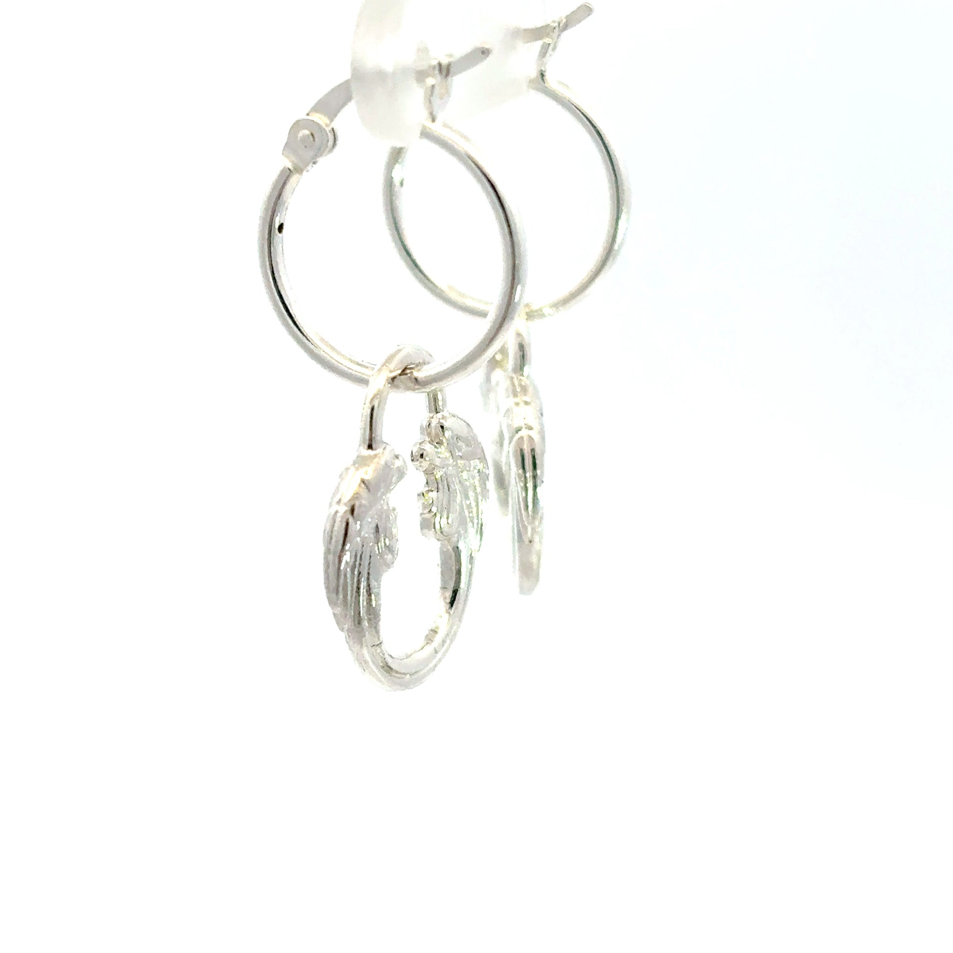 Close-up of Jesus Christ Superstar silver plated hoop earring with sculpted logo charm inspired by the iconic musical