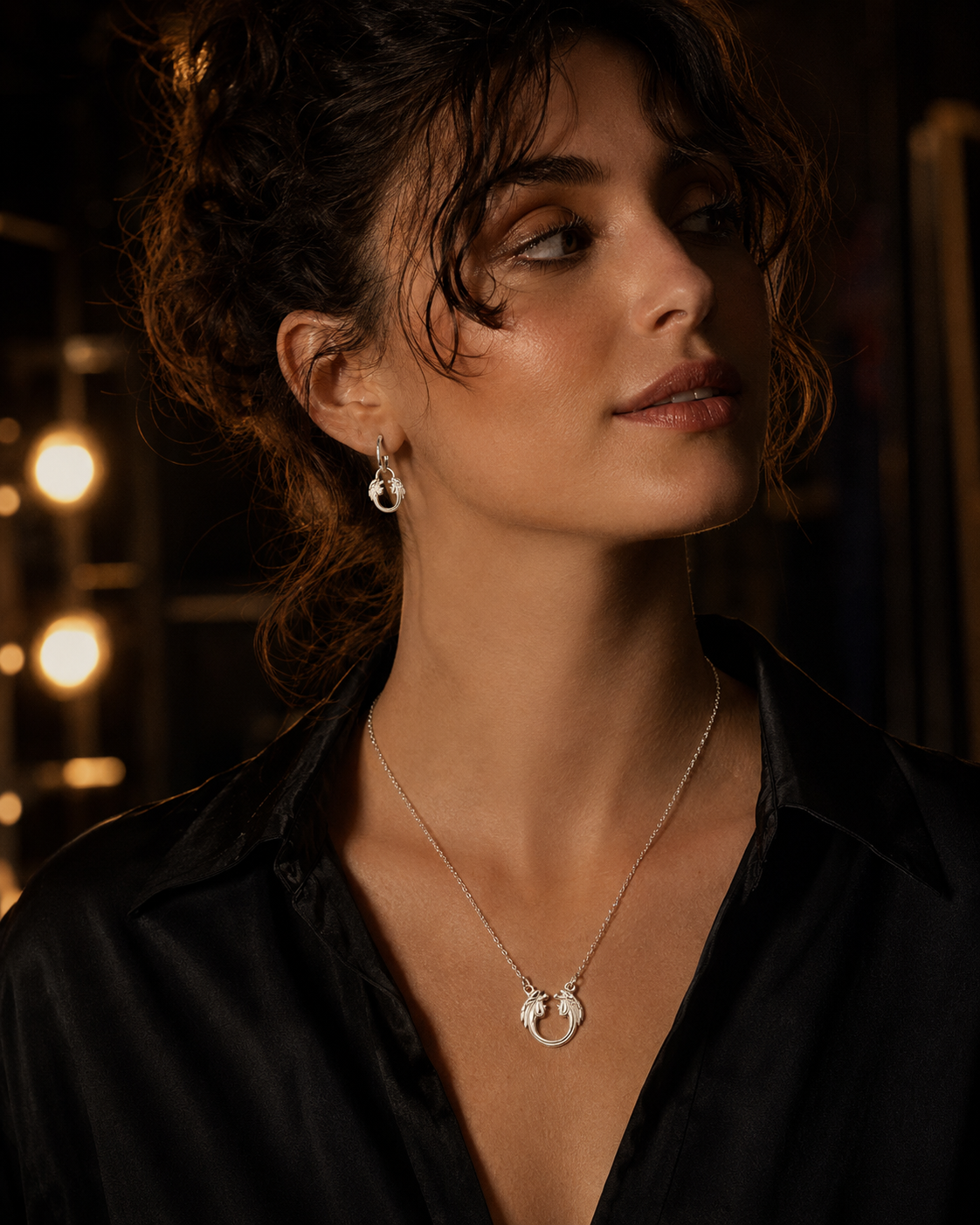 Theatre fan wearing Jesus Christ Superstar sterling silver necklace, official Andrew Lloyd Webber jewellery gift.