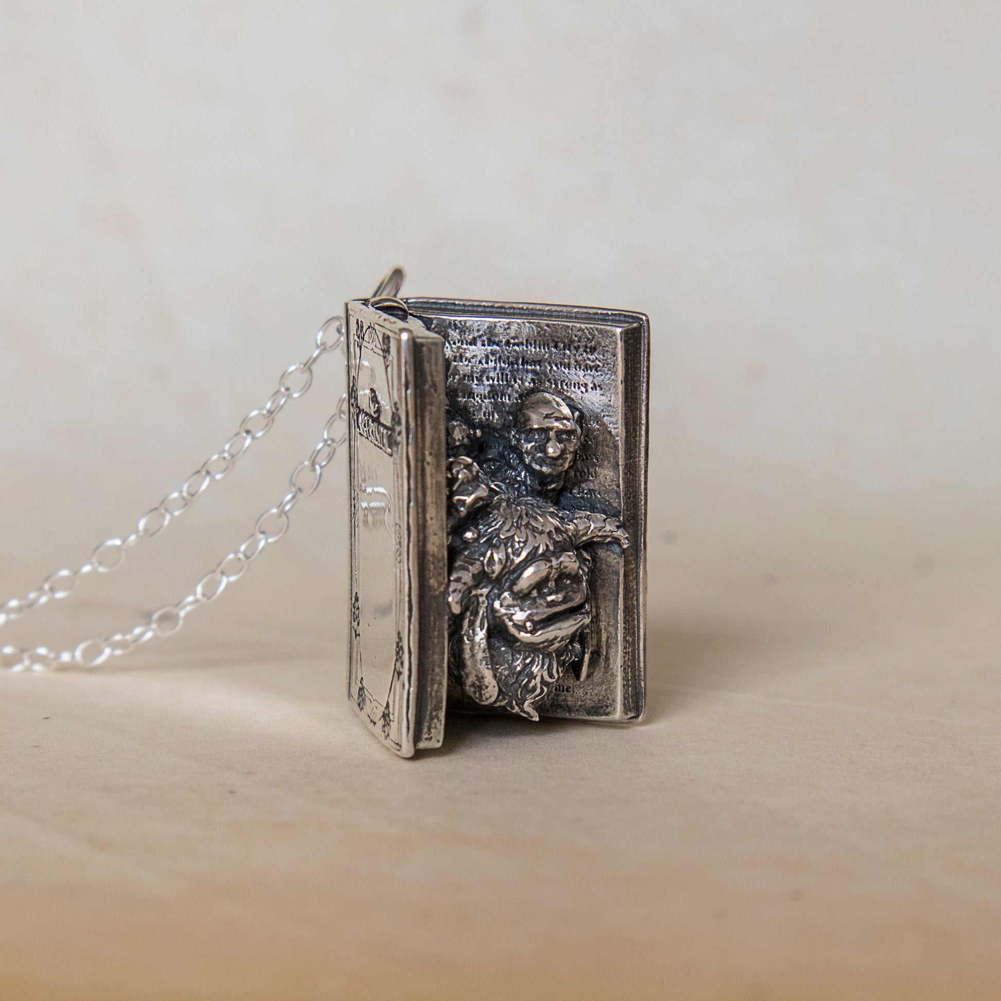 Labyrinth Book Charm Necklace in sterling silver, detailed view of open book design, officially licensed collector’s jewellery.