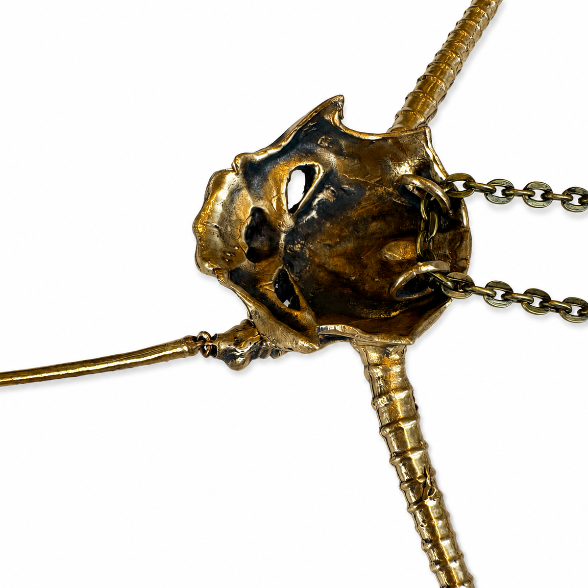 Close-up of the reverse of the bronze Goblin King mask showing its handcrafted sculptural construction.