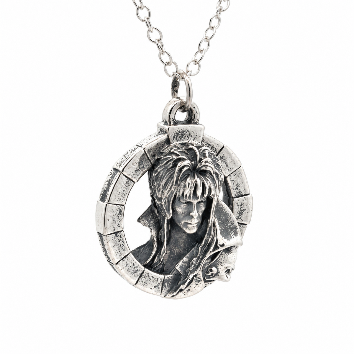Angled view of the Labyrinth Jareth Goblin King sterling silver pendant necklace on a white background.