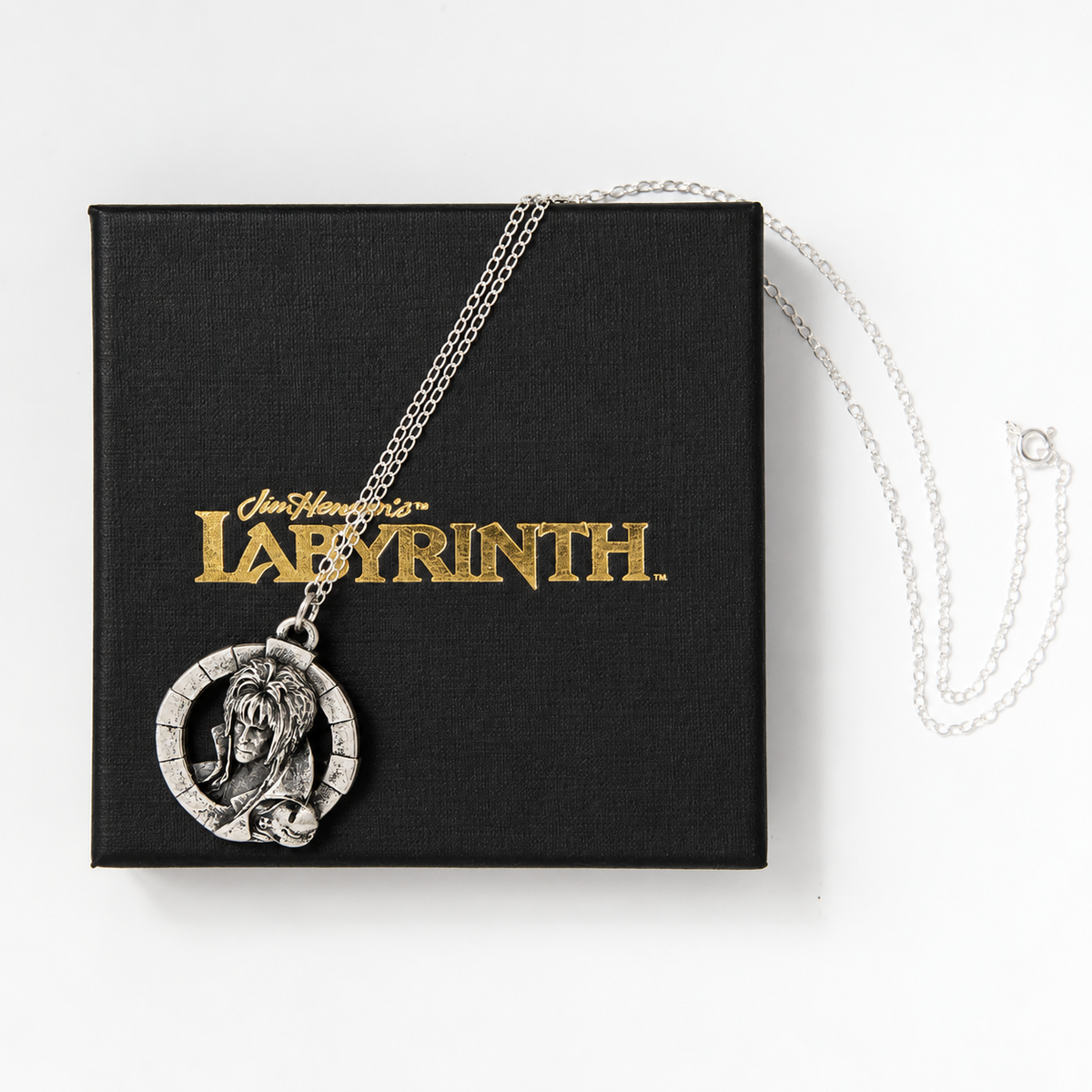 Jareth the Goblin King sterling silver necklace resting on a black gift box with gold Labyrinth branding.