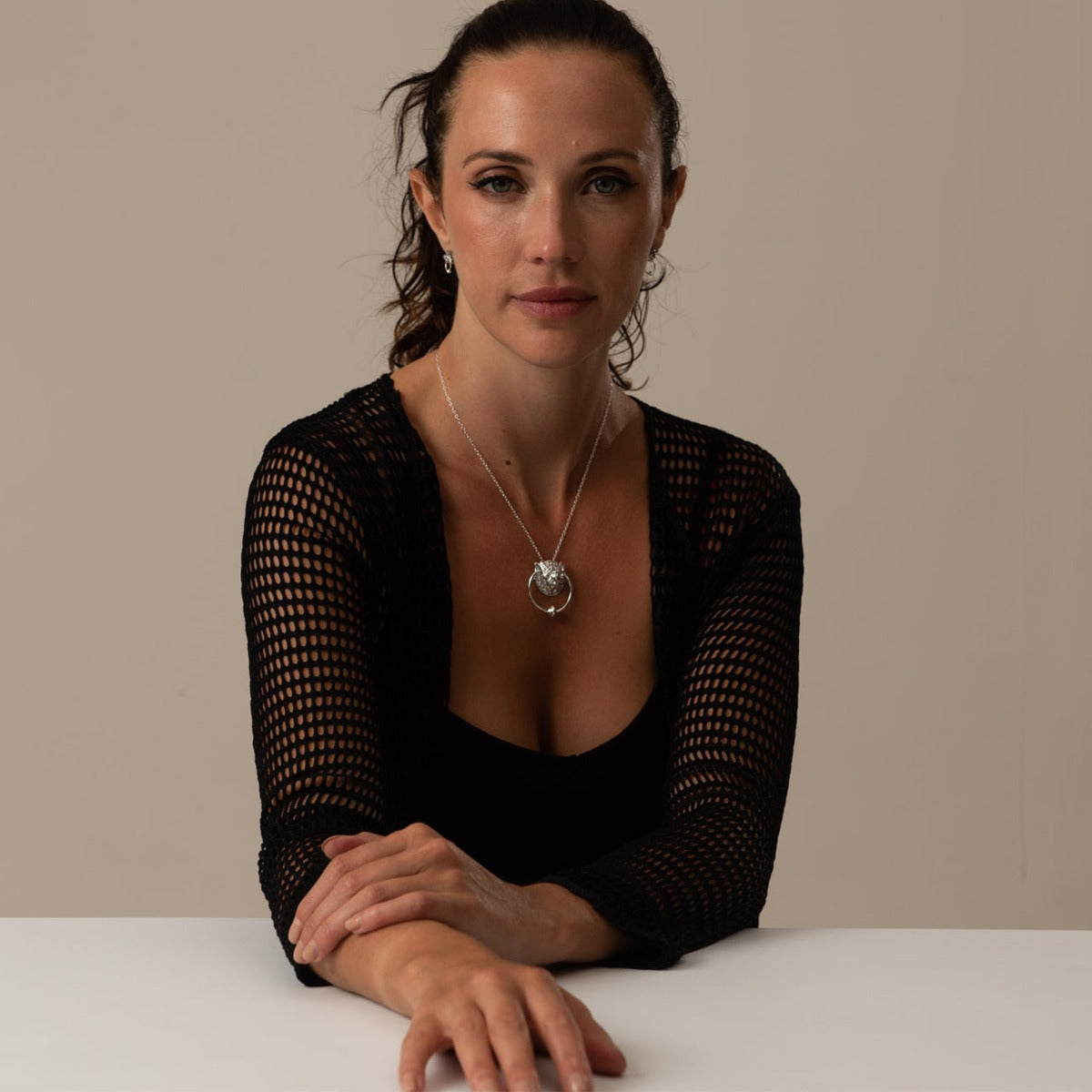 Model wearing the Labyrinth Right Door Knocker sterling silver necklace