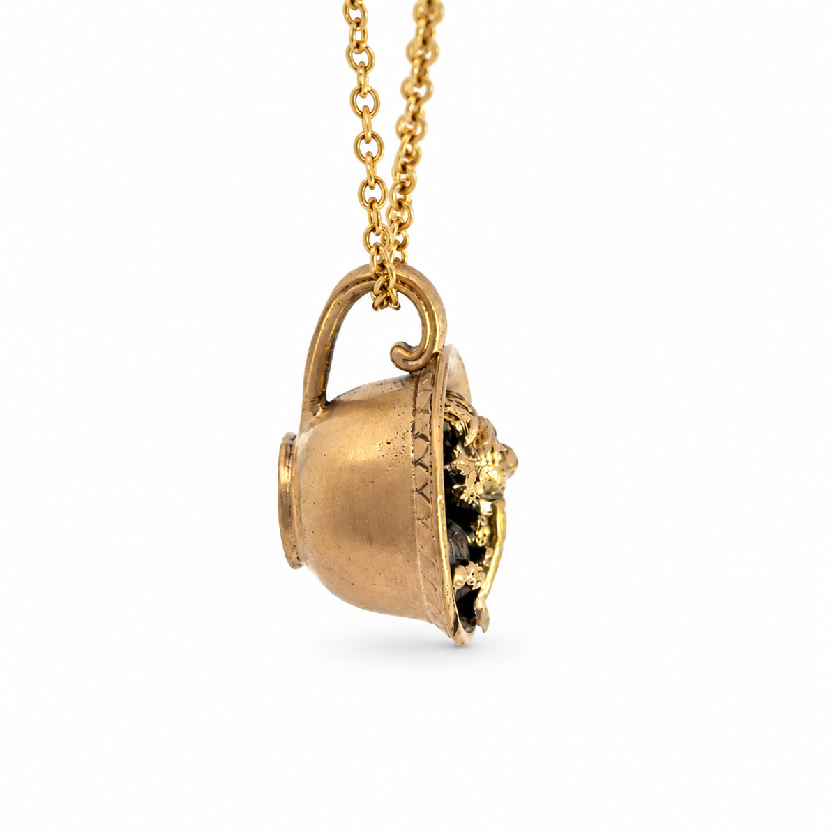 Side profile of the Labyrinth Worm in a Cup bronze pendant and chain