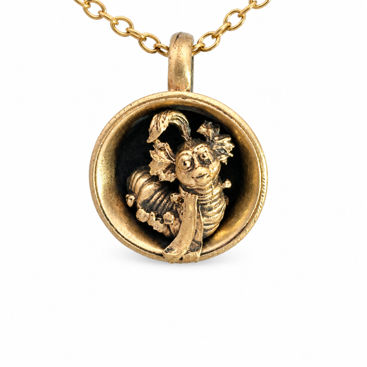 Close-up of officially licensed Labyrinth Worm in a Cup bronze pendant