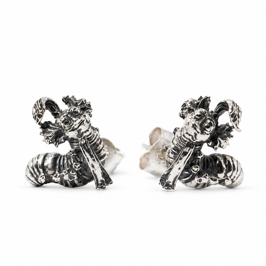 Sterling silver Labyrinth Worm stud earrings with oxidised detailing on a clean white background.