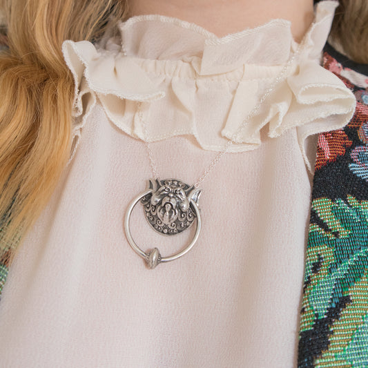 Handcrafted Right Door Knocker Necklace inspired by Jim Henson’s Labyrinth, made from recycled sterling silver. Detailed pendant captures the beloved door knocker character with a movable ring, hanging from a delicate chain. Perfect for film fans and jewellery collectors