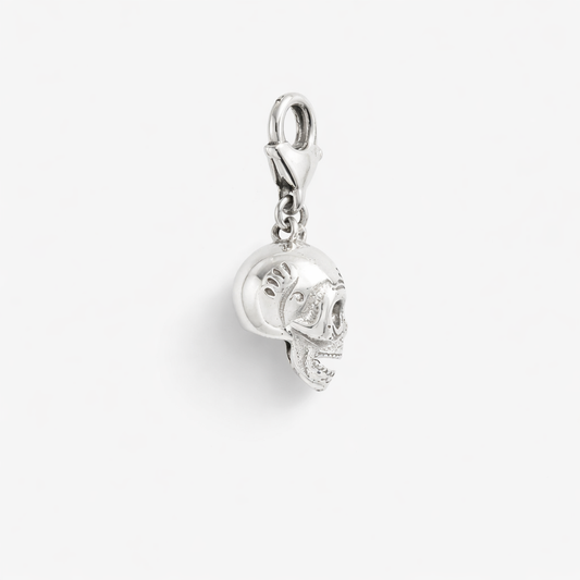 Licensed To Charm Frida-inspired calavera skull charm in sterling silver, side view with lobster clasp on a white background