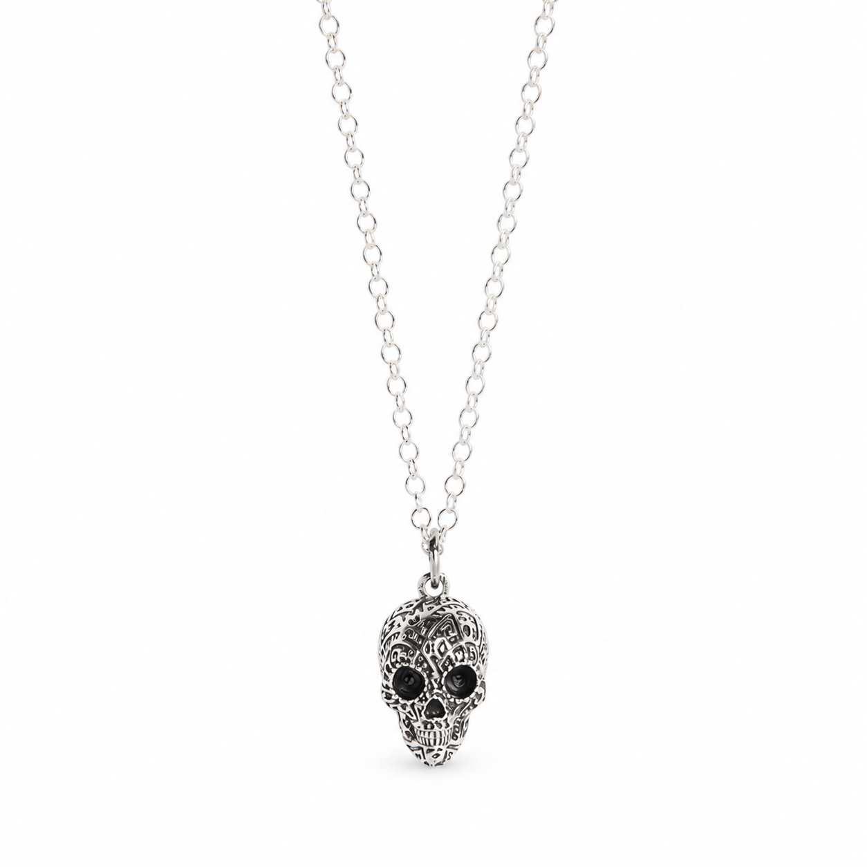 Licensed To Charm Frida Kahlo Aztec Skull sterling silver necklace with blackened detailing on a white background.