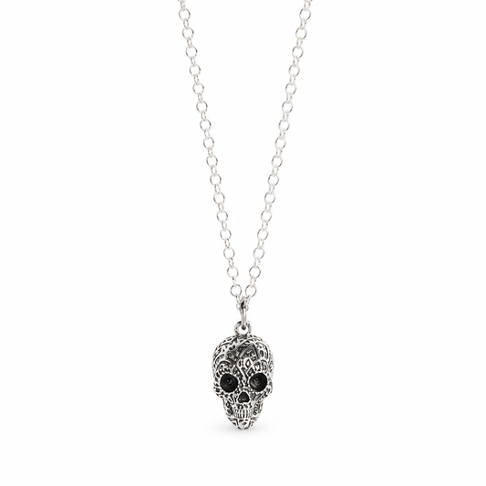 Licensed To Charm Frida Kahlo Aztec Skull sterling silver necklace with blackened detailing on a white background.