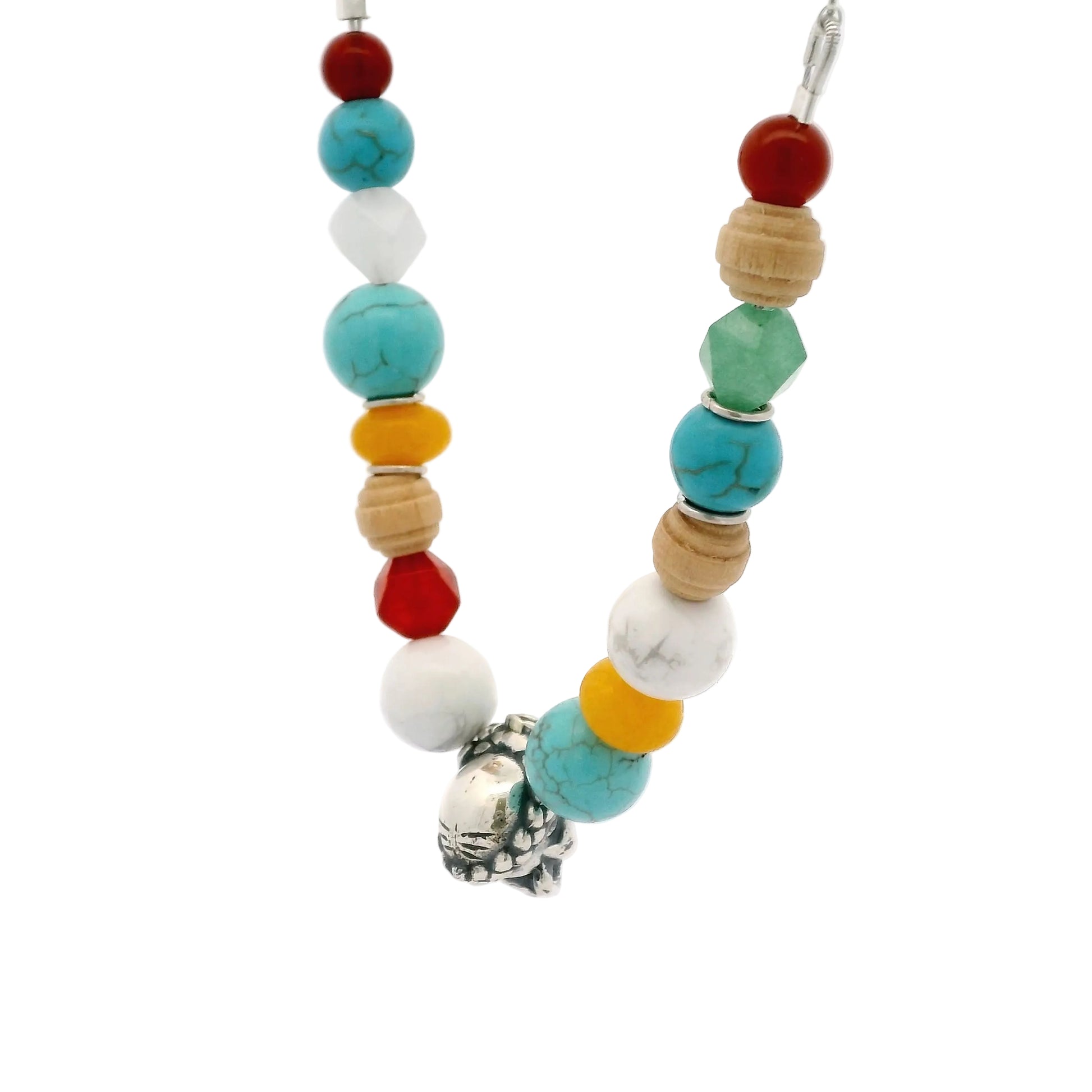 Angled view of Licensed To Charm Frida Kahlo Beaded Sugar Skull Necklace in sterling silver with turquoise, red, yellow and natural beads