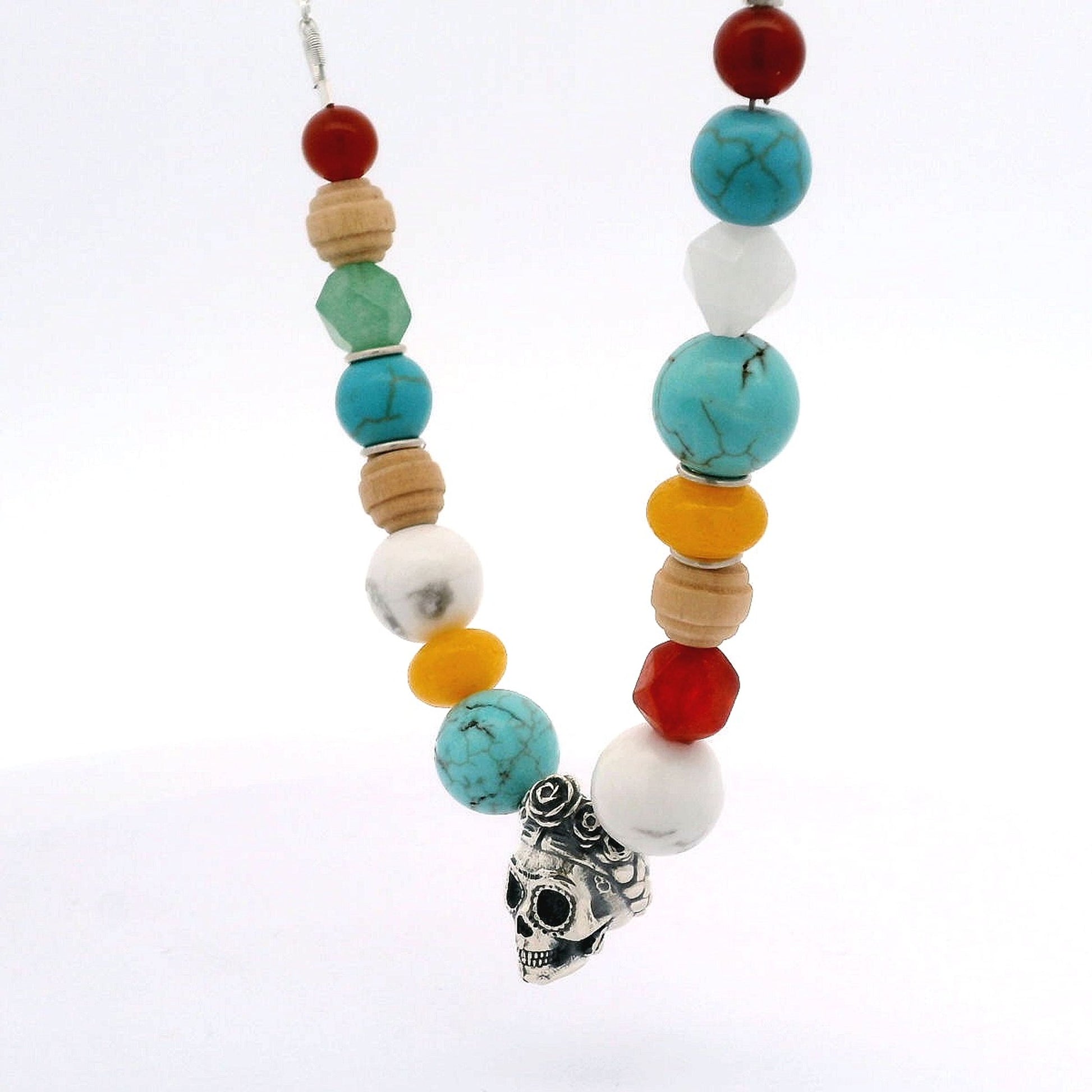 Close-up of Licensed To Charm Frida Kahlo Beaded Sugar Skull Necklace with oxidised sterling silver skull charm and vibrant hand-strung beads