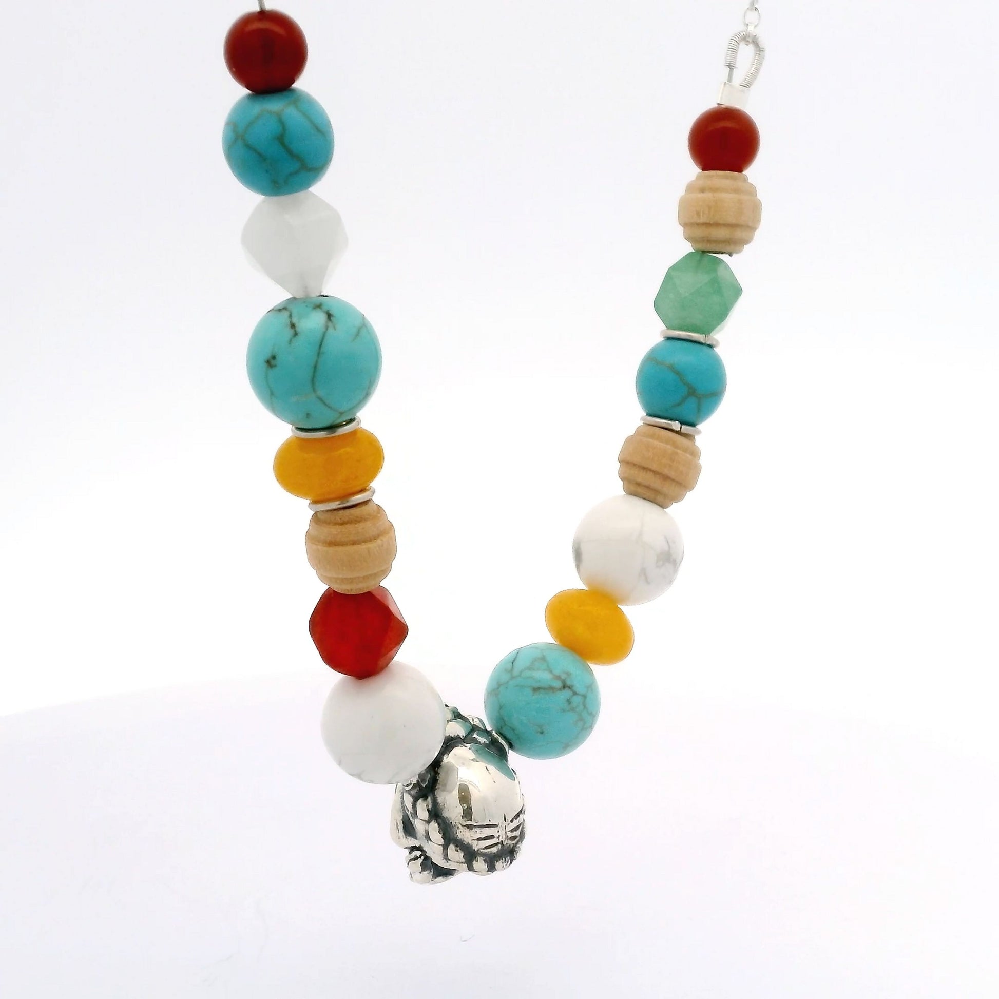 Detail of Licensed To Charm Frida Kahlo Beaded Sugar Skull Necklace showing colourful semi-precious beads and sterling silver sugar skull charm