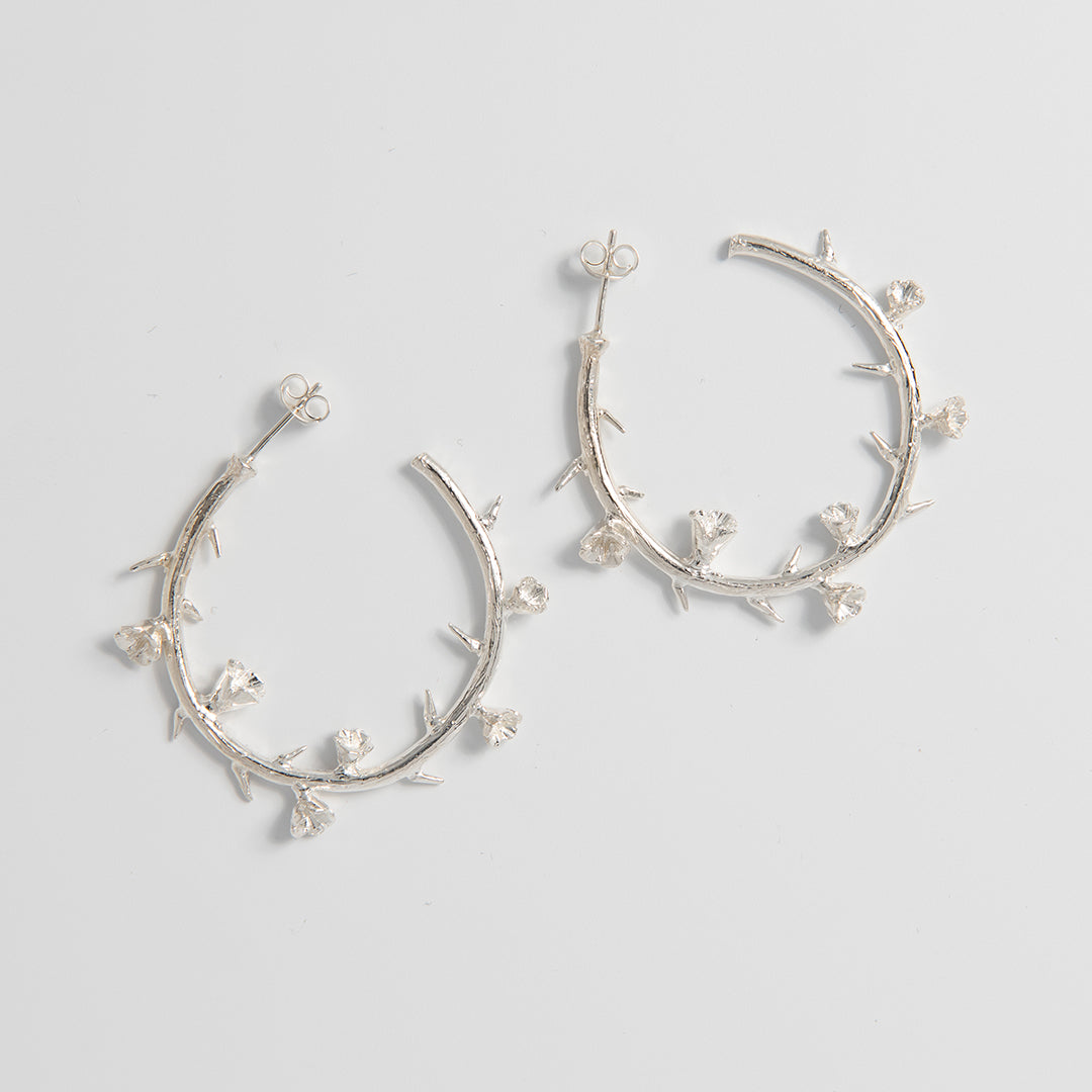 Licensed To Charm official Frida Kahlo Thorn Hoop Earrings in sterling silver, inspired by Self-Portrait with Thorn Necklace and Hummingbird