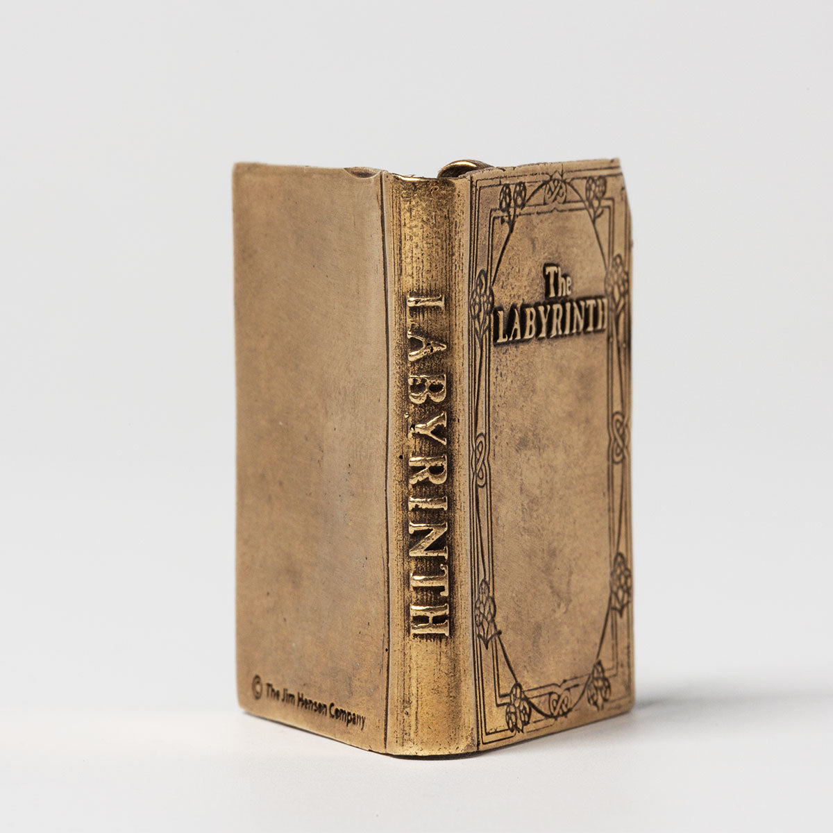 Licensed To Charm Labyrinth Bronze Character Book – Open Pages with Characters showing the spine of the book with labyrinth engraved on it along with the copyright