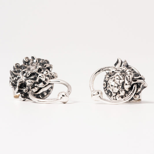 Licensed To Charm Front-facing view of the Sterling Silver Labyrinth Door Knocker Earrings, featuring one with a mouth ring and one with an ear ring as seen in the movie.