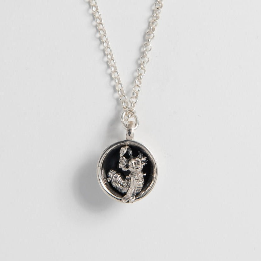 Licensed To Charm Labyrinth Worm in a Cup Necklace handmade in sterling silver, inspired by Jim Henson’s cult film.