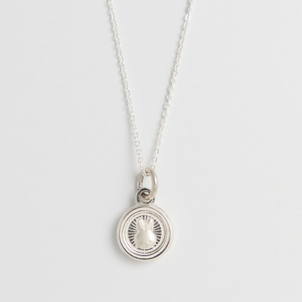 Close-up of Miffy Mini Rabbit Double Coin Necklace in recycled sterling silver, showcasing Miffy’s face in a traditional-inspired coin design on a fine chain.