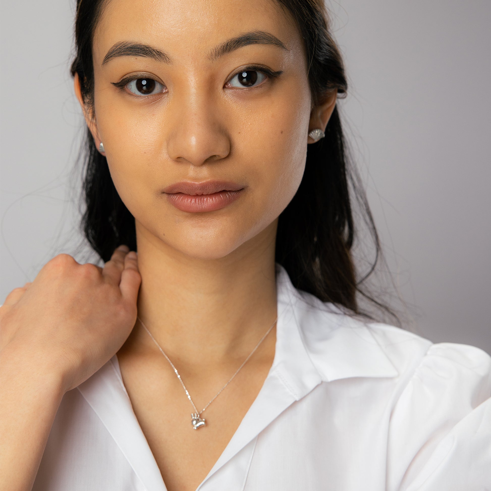 Licensed To Charm Miffy Leaping Rabbit Necklace styled with outfit, sterling silver, handmade in the UK.