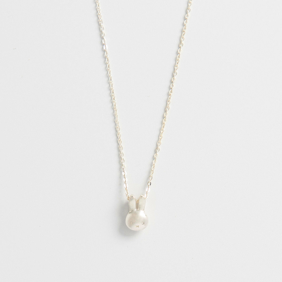 Licensed To Charm Miffy Mini Charm Necklace in sterling silver, featuring a sliding Miffy head charm. A playful and whimsical gift for Miffy fans