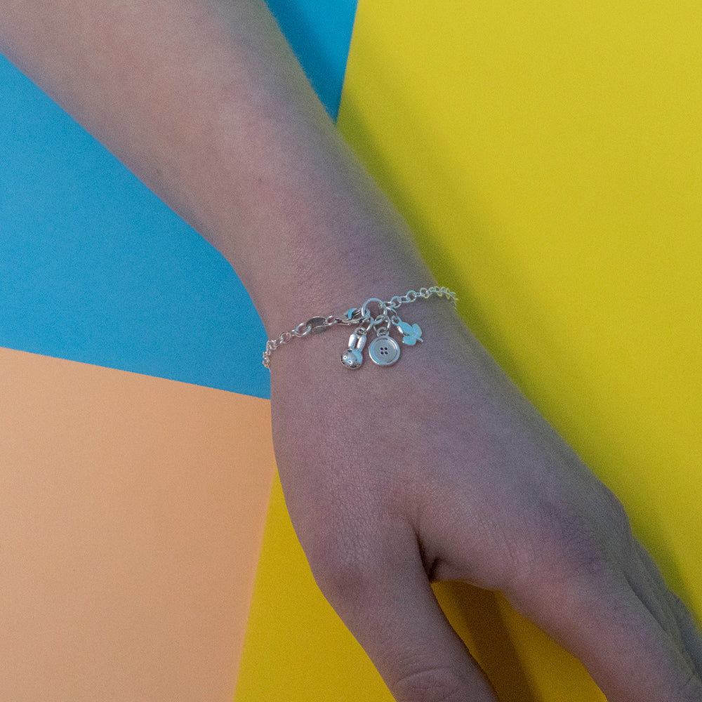 Licensed To Charm Miffy Multi-Charm Bracelet – close-up of charms (Miffy head, tulip, button)