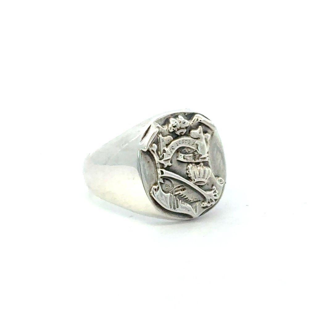Licensed To Charm handmade Moomin Crest signet ring angled to show detailed engraving.
