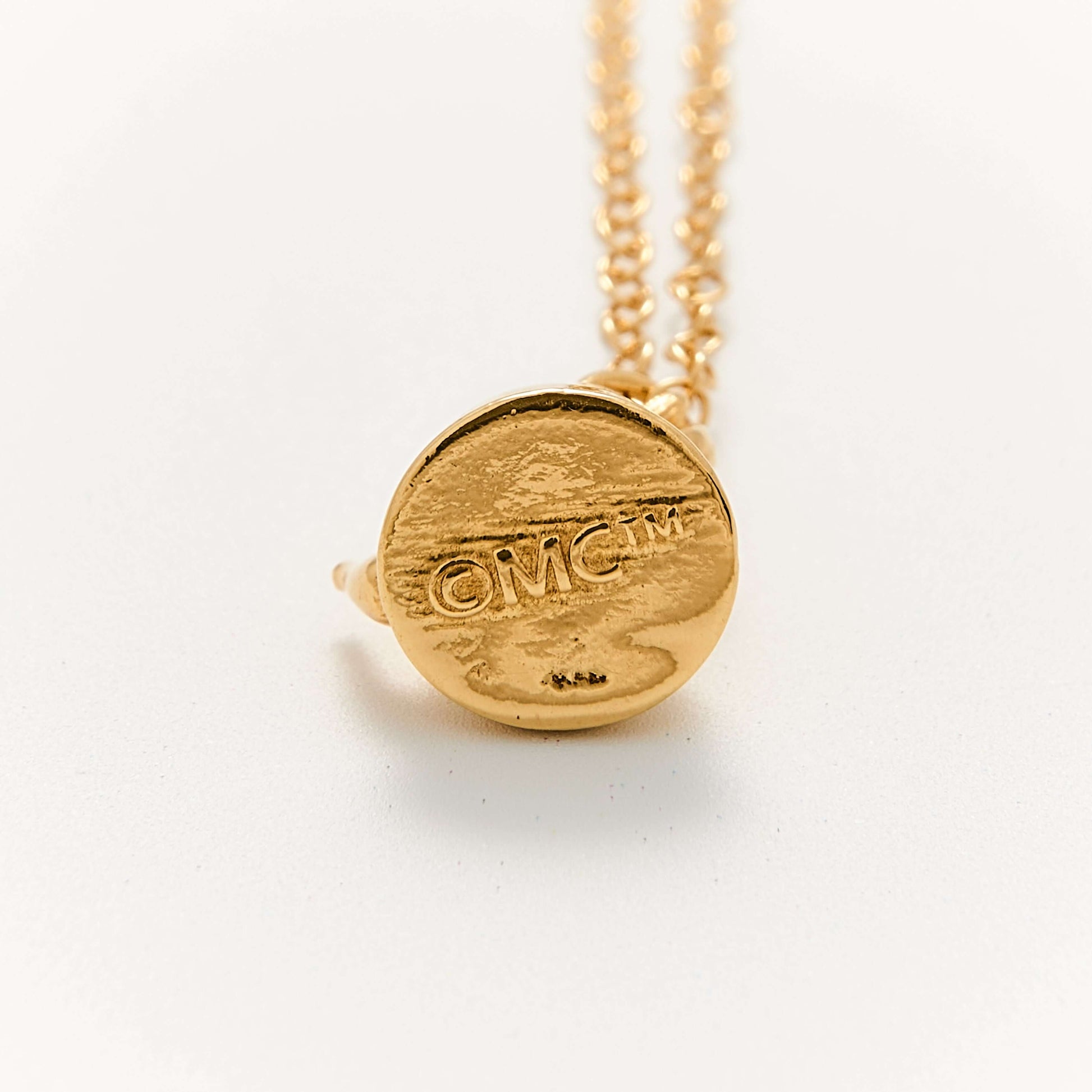 Back detail of Licensed To Charm Moomin Little My gold vermeil necklace showing hallmark engraving on pendant