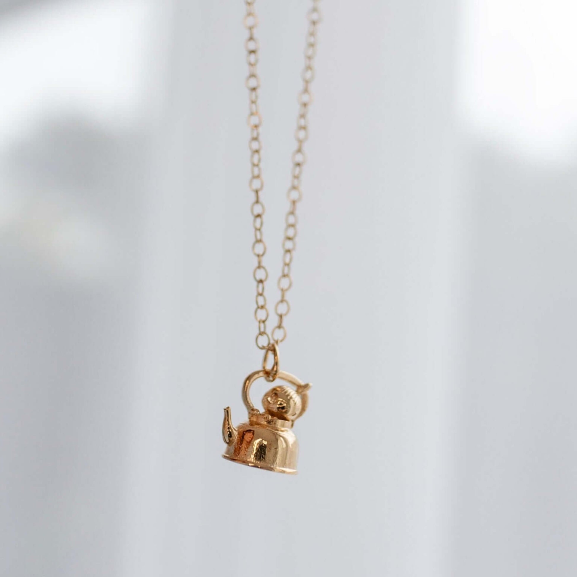Licensed To Charm Moomin Little My gold vermeil necklace hanging against soft neutral background, minimal lifestyle jewellery shot