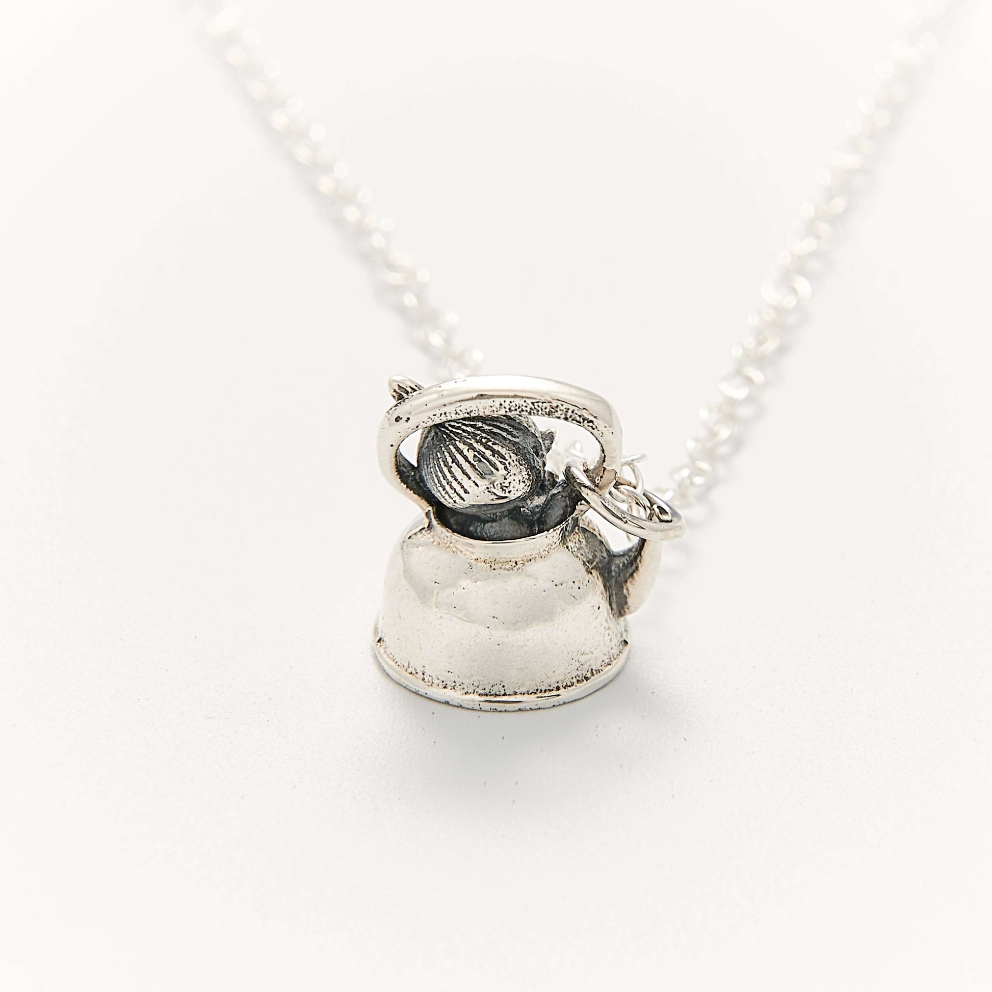 Close-up of the Licensed To Charm Moomin Little My Necklace in sterling silver showing Little My in a teapot pendant