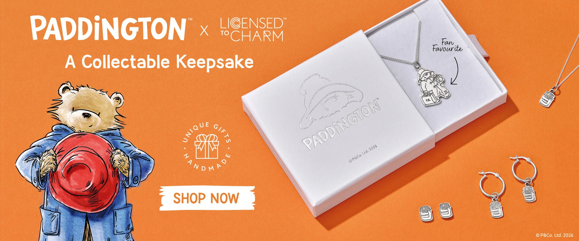 Licensed To Charm officially licensed Paddington Bear collectable keepsake jewellery banner featuring sterling silver necklace, hoop earrings and gift box on an orange background