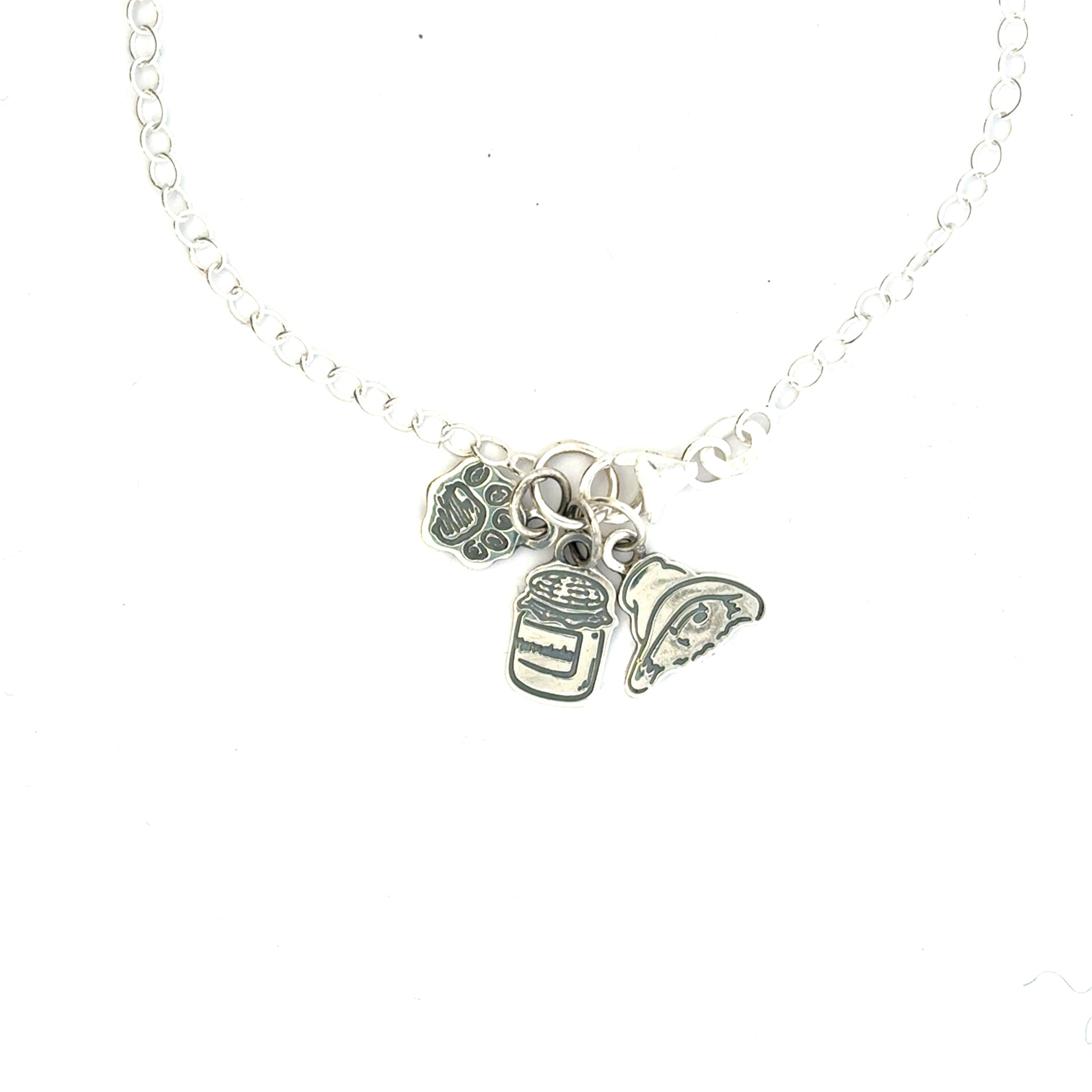 Licensed To Charm Paddington sterling-silver charm bracelet angled view showing polished finish and engraved detail