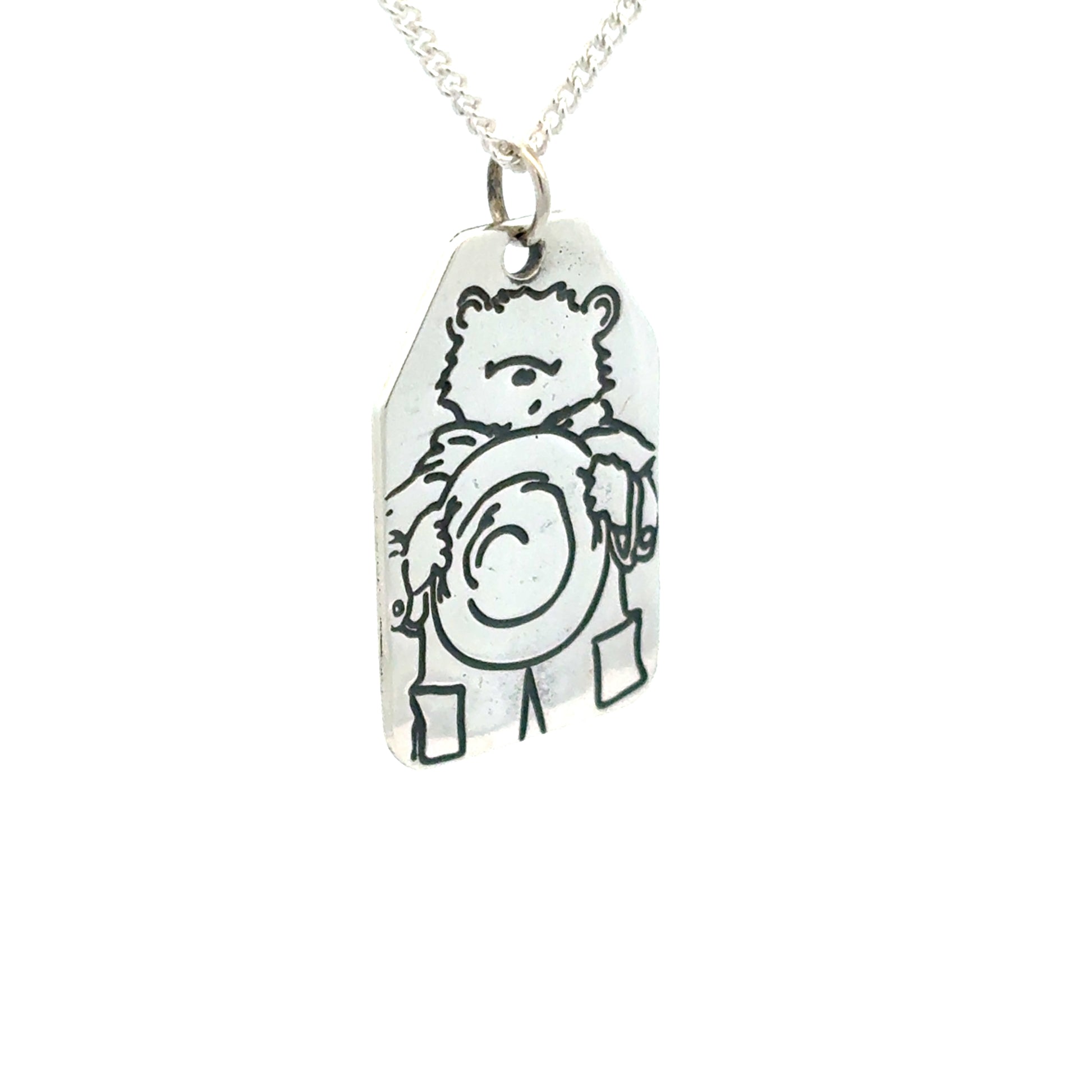 Licensed To Charm Sterling-silver Paddington luggage tag necklace angled view highlighting engraved edges