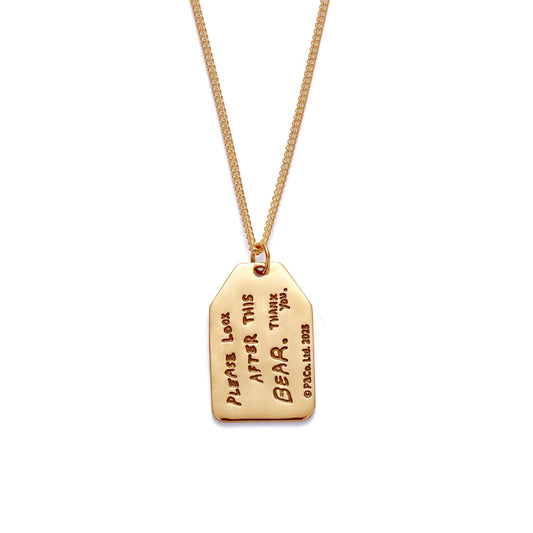 Licensed To Charm Reversible Paddington necklace — illustration front, “Please look after this bear” reverse