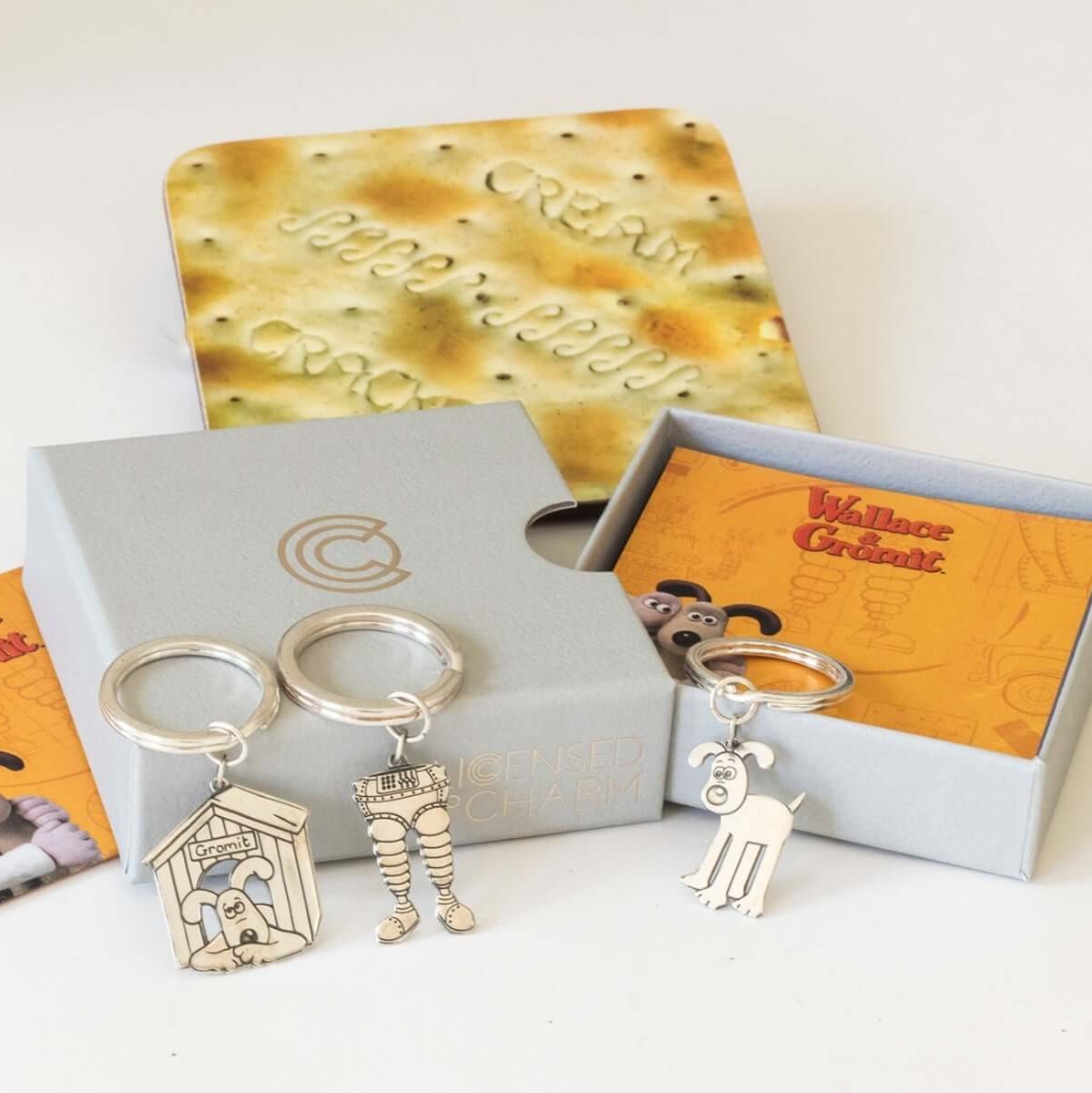 Licensed to Charm Standing Gromit silver keyring displayed with Wallace & Gromit character gifts