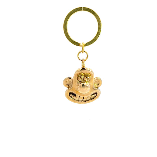 Licensed to Charm Wallace 3D head brass keyring from Wallace & Gromit on a white background handing