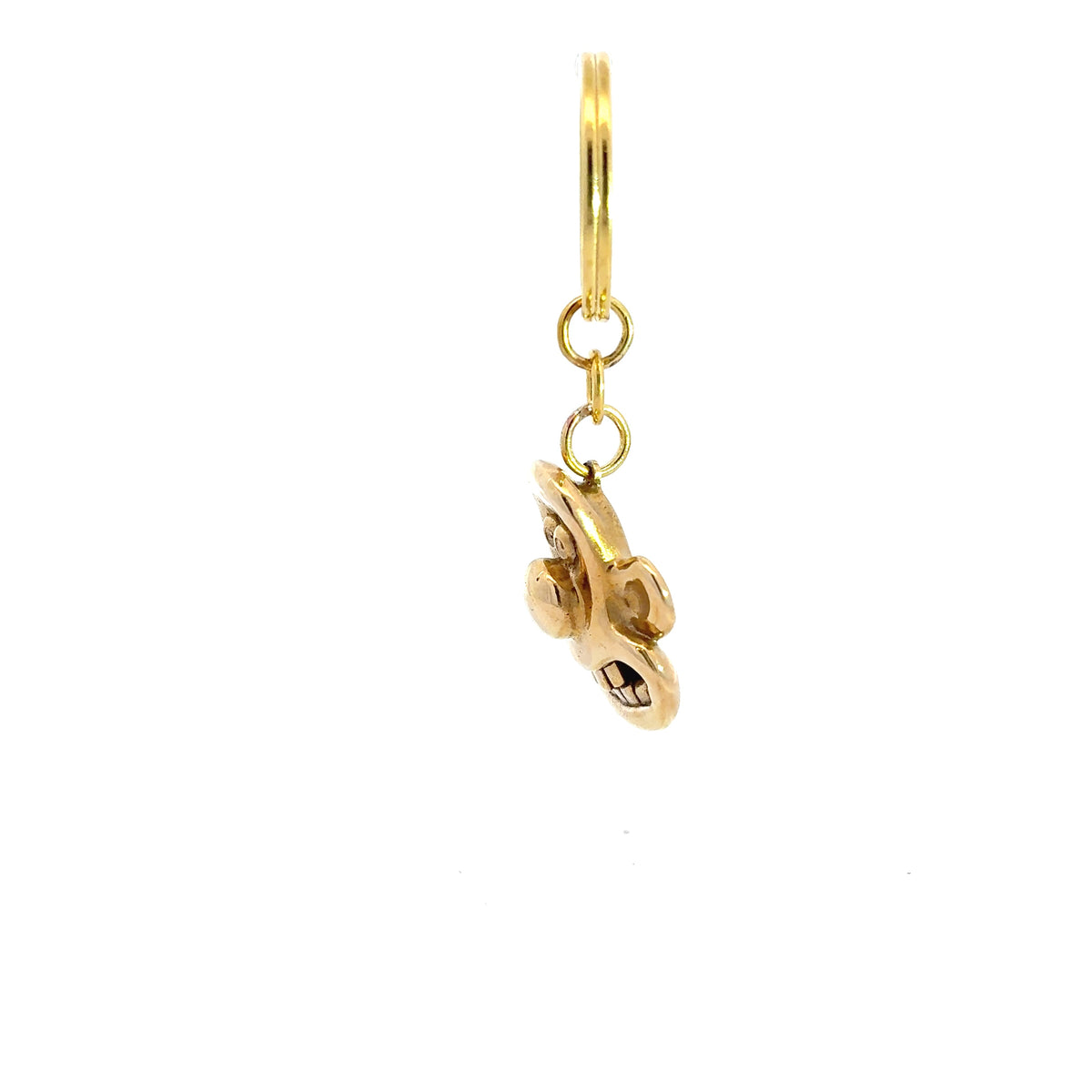 Licensed to Charm Wallace 3D head brass keyring from Wallace & Gromit on a white background sideview