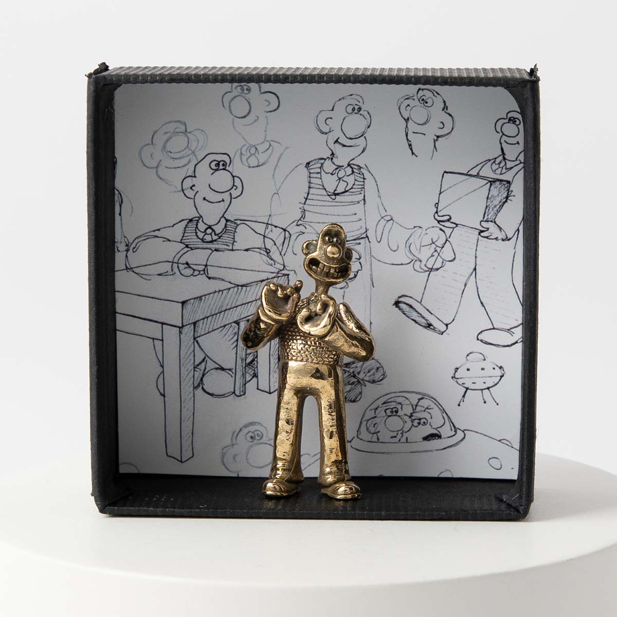 Licensed To Charm Bronze Wallace Figurine capturing the eccentric cheese-loving inventor from Wallace & Gromit. Packaged in a printed gift box