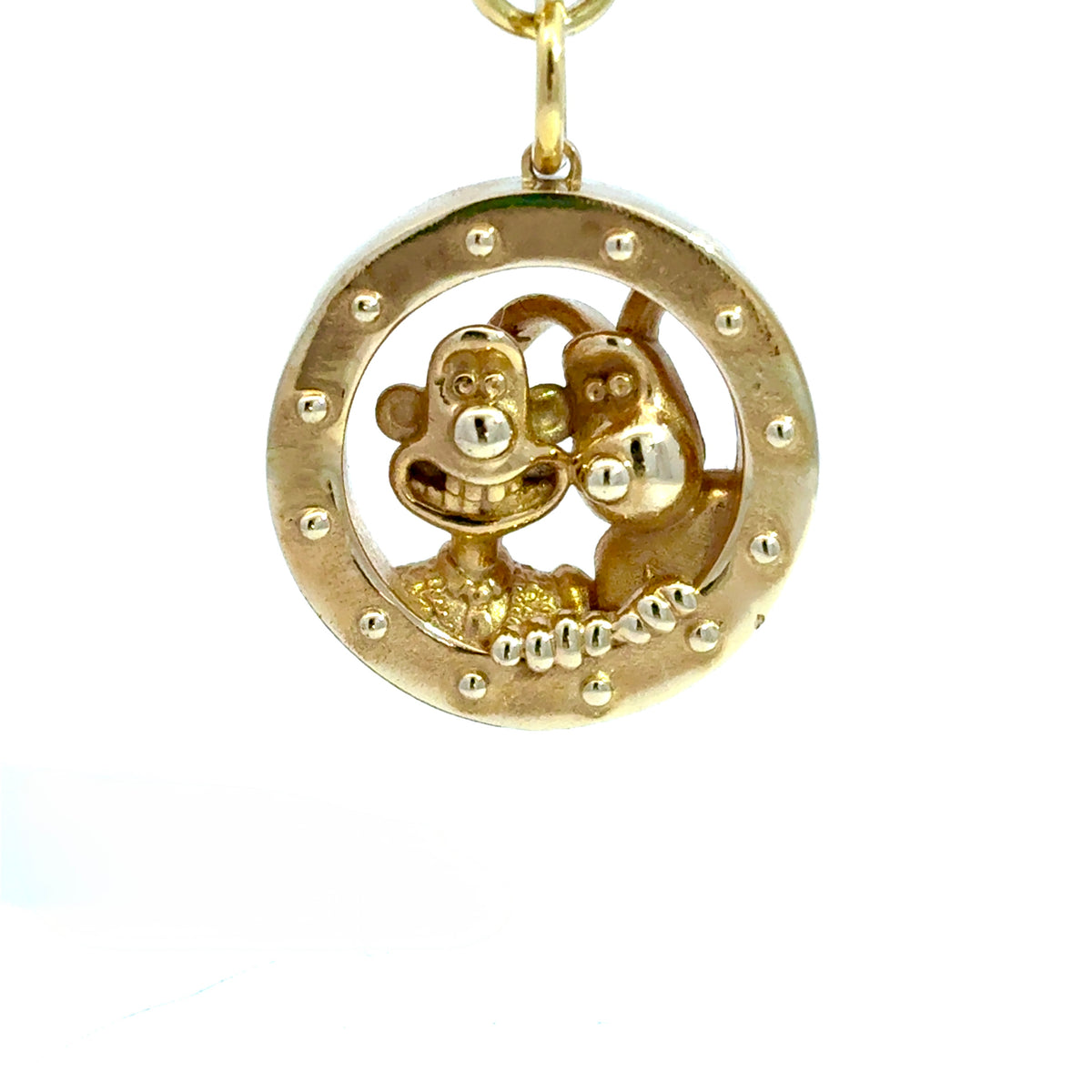Licensed To Charm brass rocket porthole keyring, close-up of Wallace and Gromit looking through the window