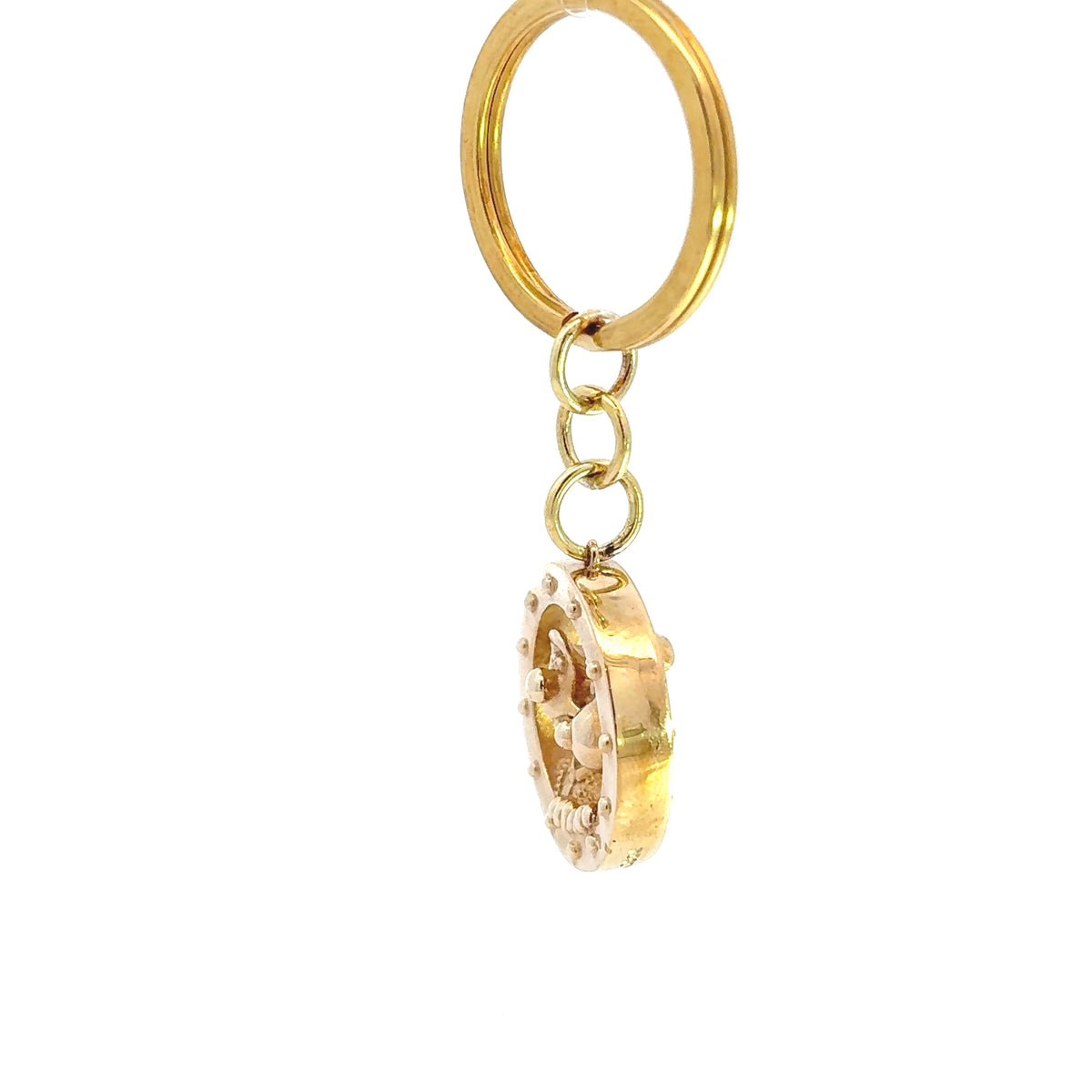 Licensed To Charm Wallace & Gromit rocket porthole brass keyring shown from the side to reveal its depth