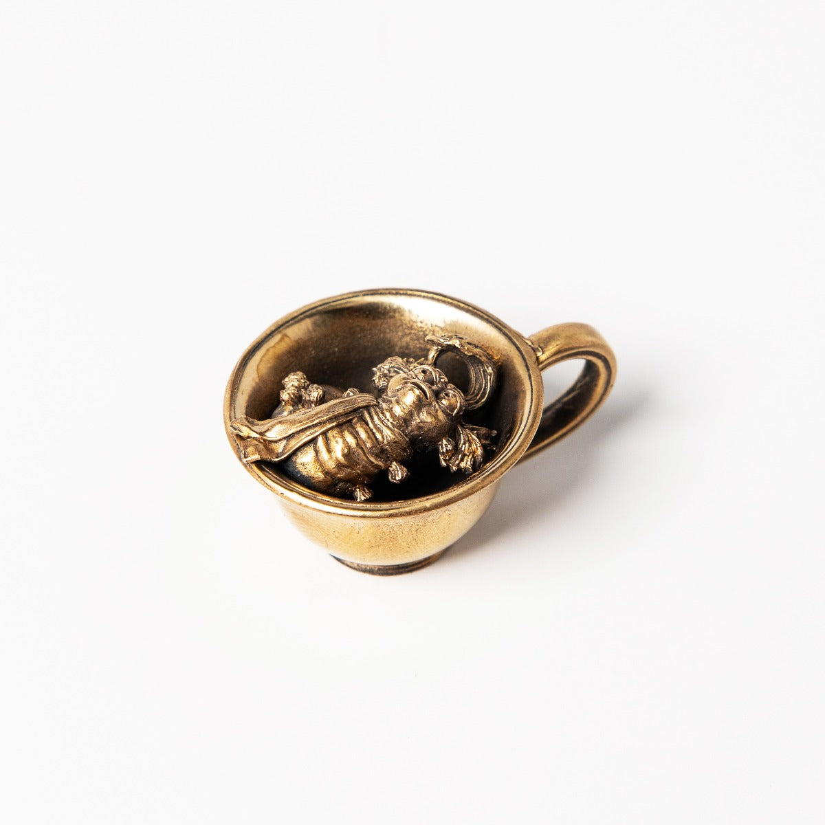 Licensed To Charm Labyrinth Worm in a Cup Miniature, handcrafted in bronze with an antique patina finish. Features the charming Worm character seated in a teacup, inspired by Jim Henson’s Labyrinth. A whimsical collector’s piece for fans of the 80s classic.