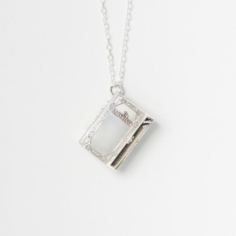 Labyrinth Story Book sterling silver necklace on a white background