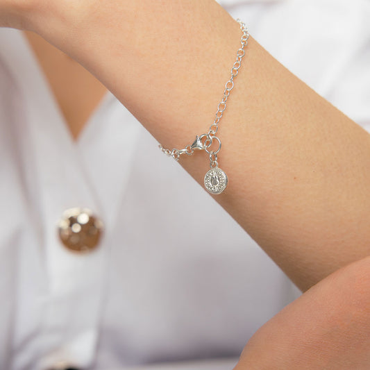 Miffy Mini Coin Charm Bracelet displayed on a wrist, showcasing the recycled sterling silver finish and charming Miffy coin design.