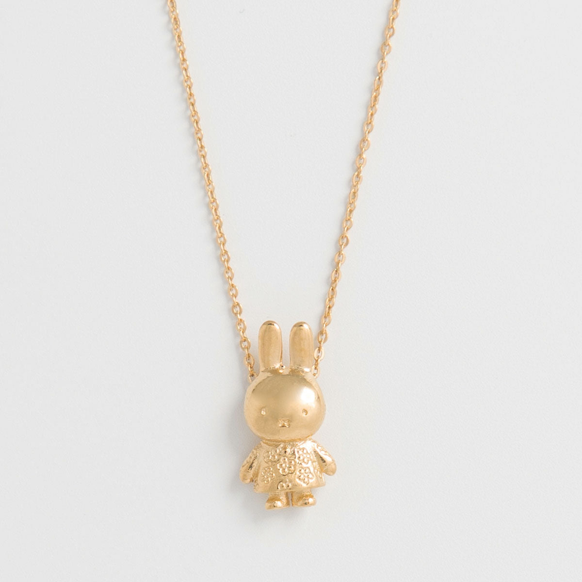 Handcrafted 18ct gold vermeil necklace featuring a Miffy flower charm with daisies. The pendant slides freely on a silver chain with a spring clasp closure. 