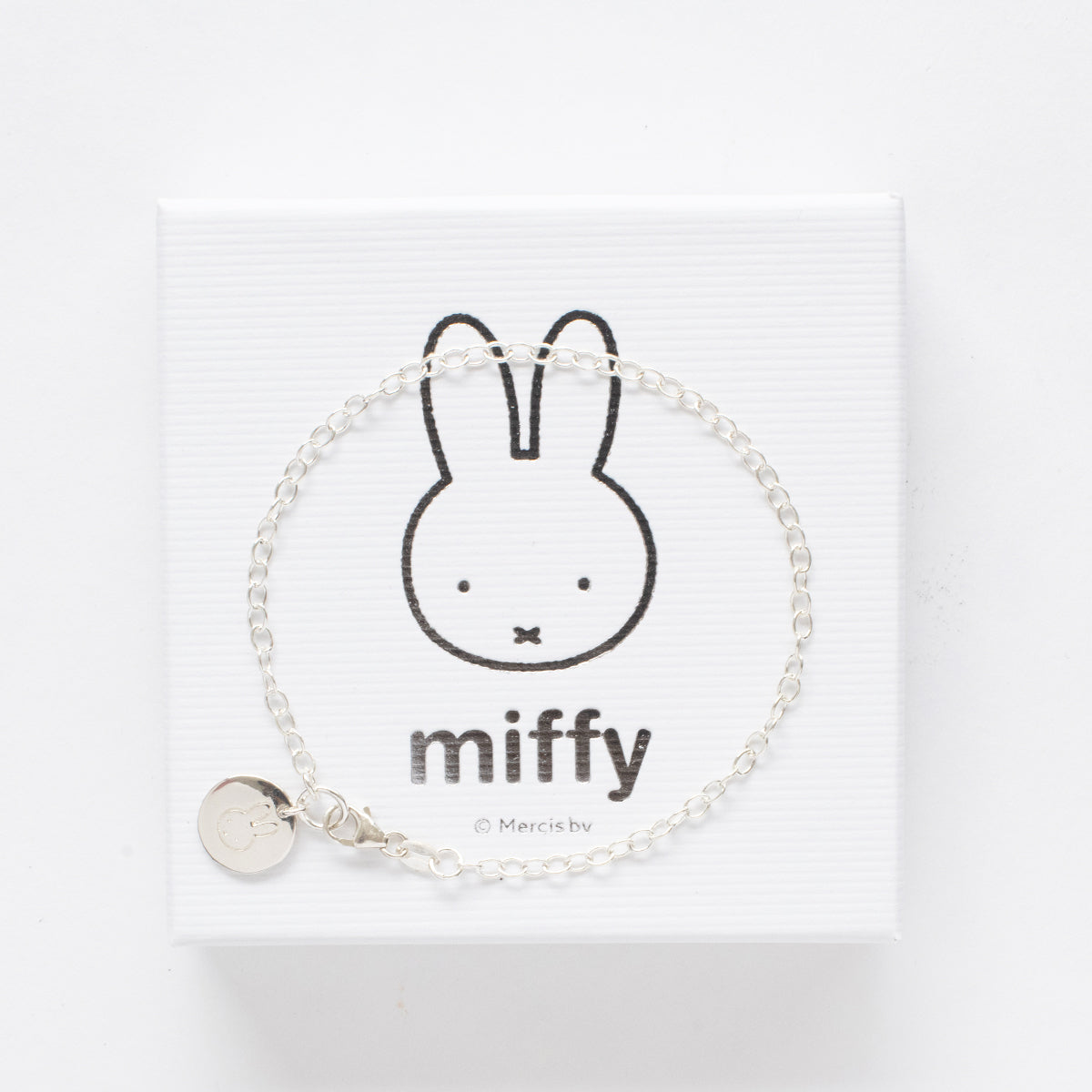 Close-up of Miffy Disc Charm Bracelet in sterling silver, showcasing Miffy’s face on a round disc charm with intricate detailing.