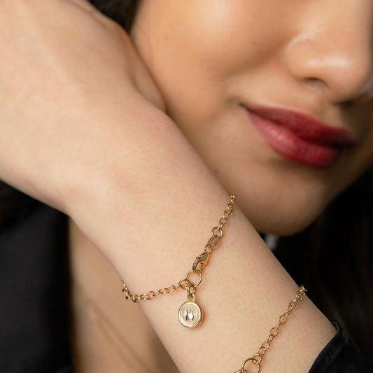 Miffy Mini Coin Charm Bracelet displayed on a wrist, highlighting the gold vermeil finish and symbolic Miffy rabbit coin charm.