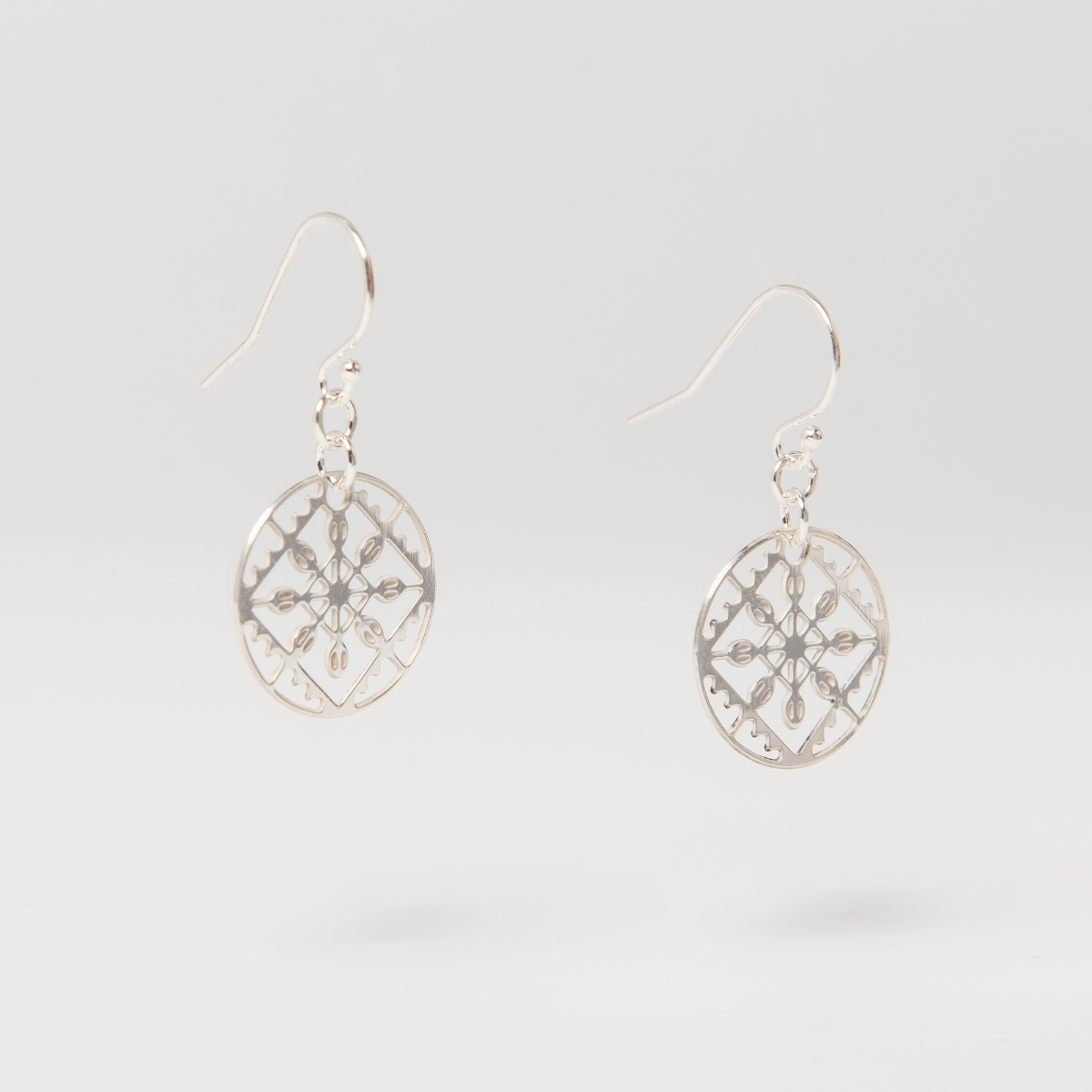 Close-up of the sterling silver Lace Drop Earrings highlighting the fine lace detailing and elegant drop silhouett