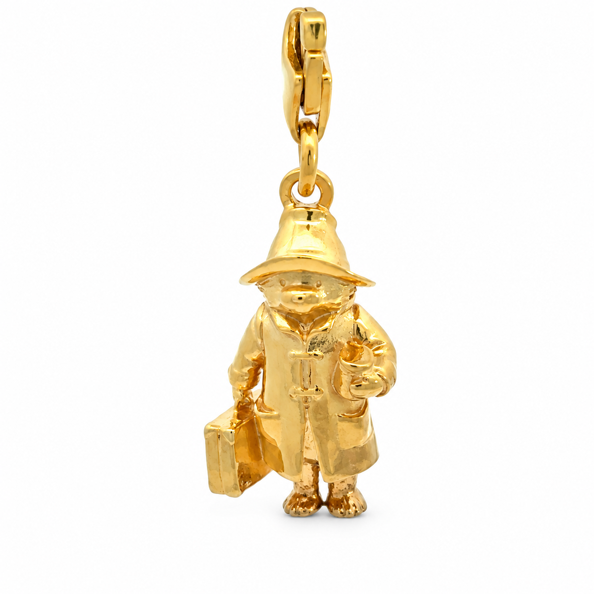 Close-up of the 18ct gold vermeil Paddington charm highlighting his detailed duffle coat, hat, suitcase and marmalade jar.