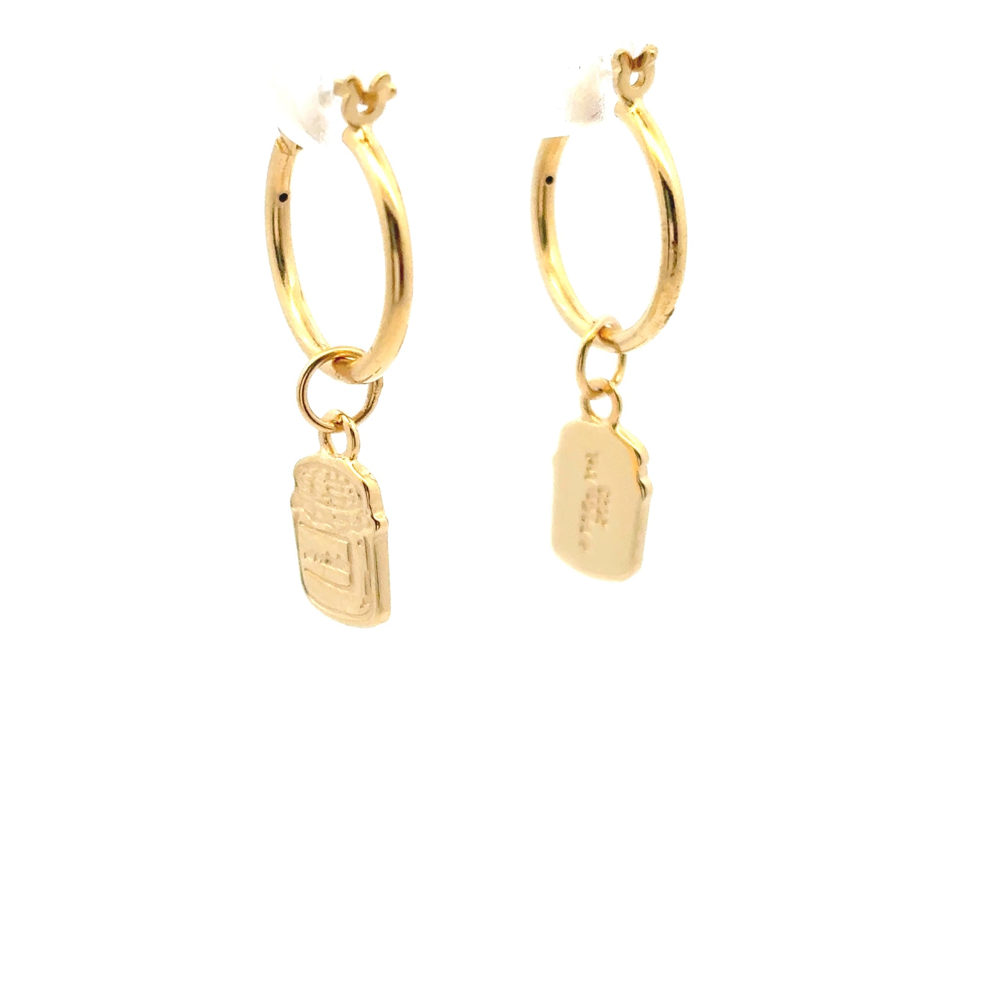 Licensed to charm Close-up of Paddington™ Marmalade Jar charm on gold hoop earrings